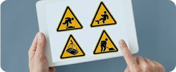 Señales de seguridad laboral con iconos de riesgo en pantalla